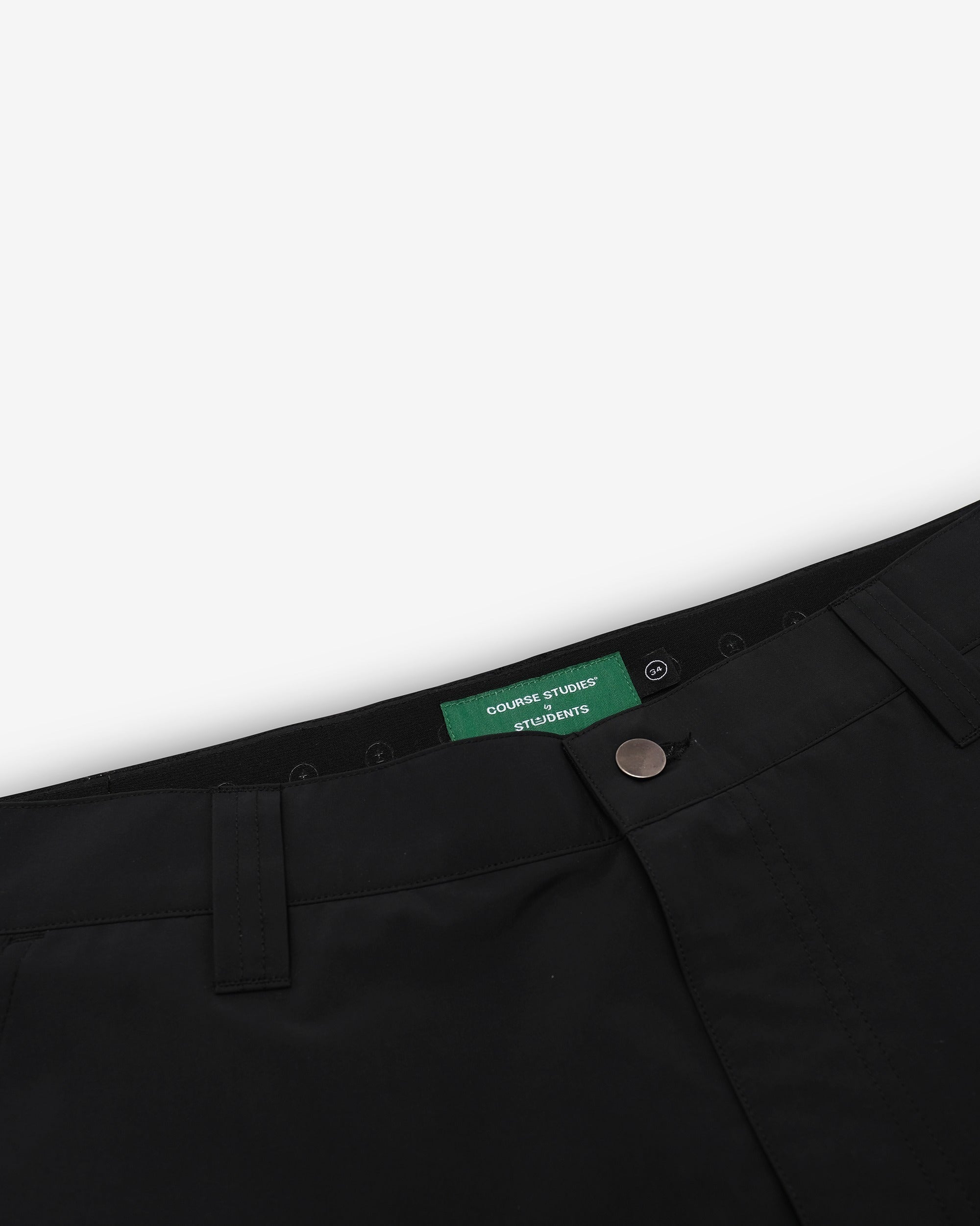 Black pants with a green label on a white background