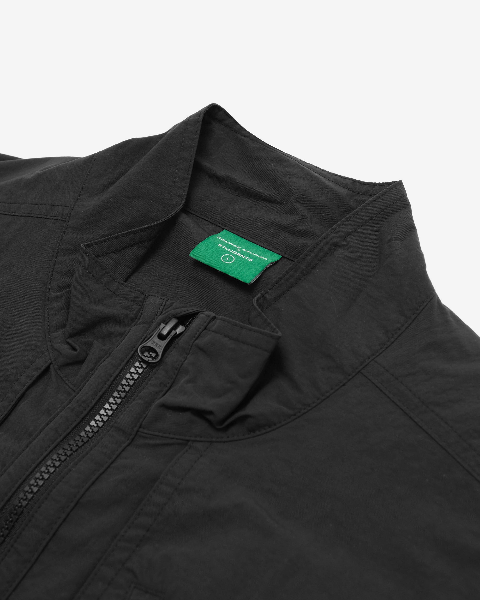 Black jacket with a green label on a white background