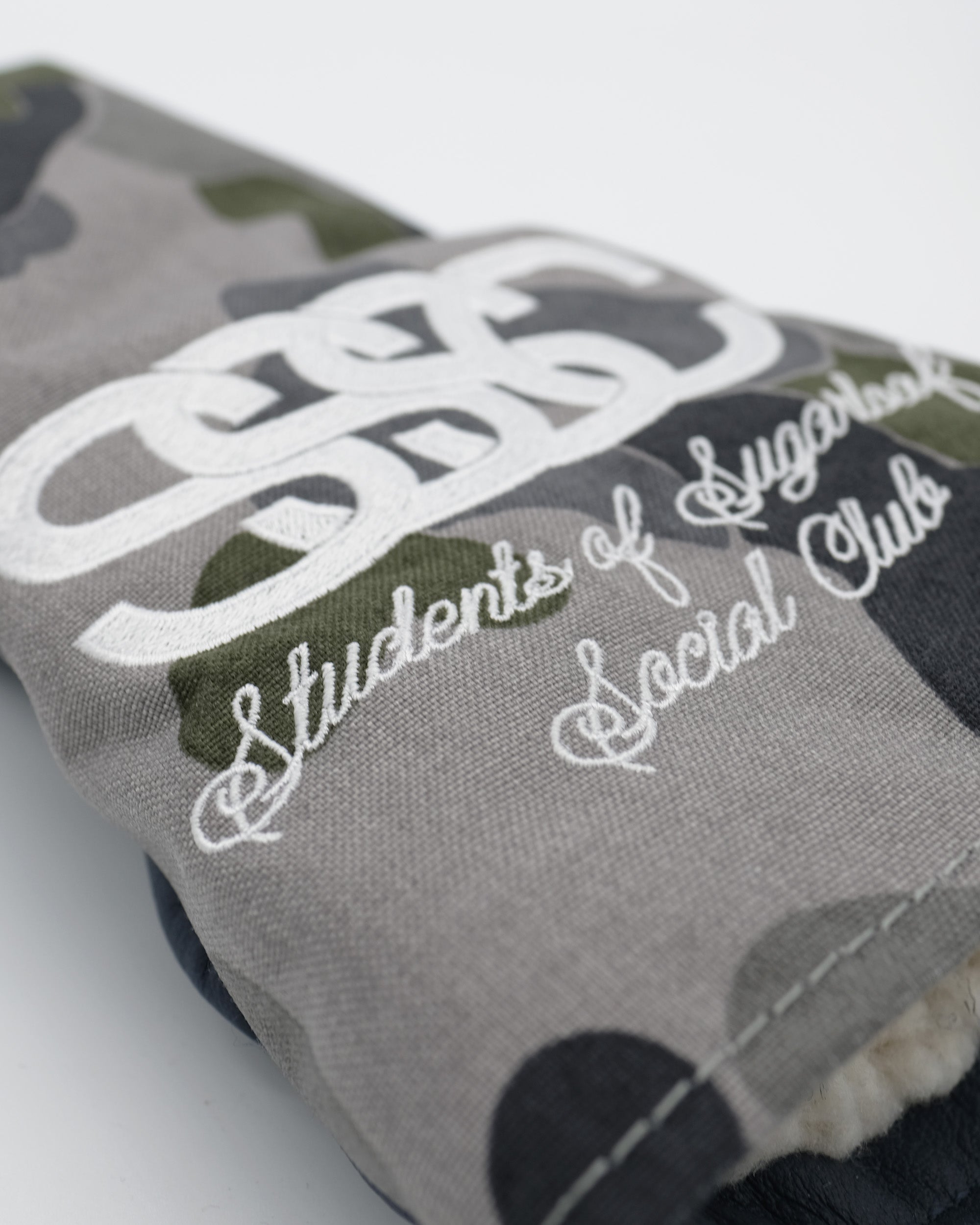 Gray fabric pouch with 'Students of Social Club' text and logo on a white background