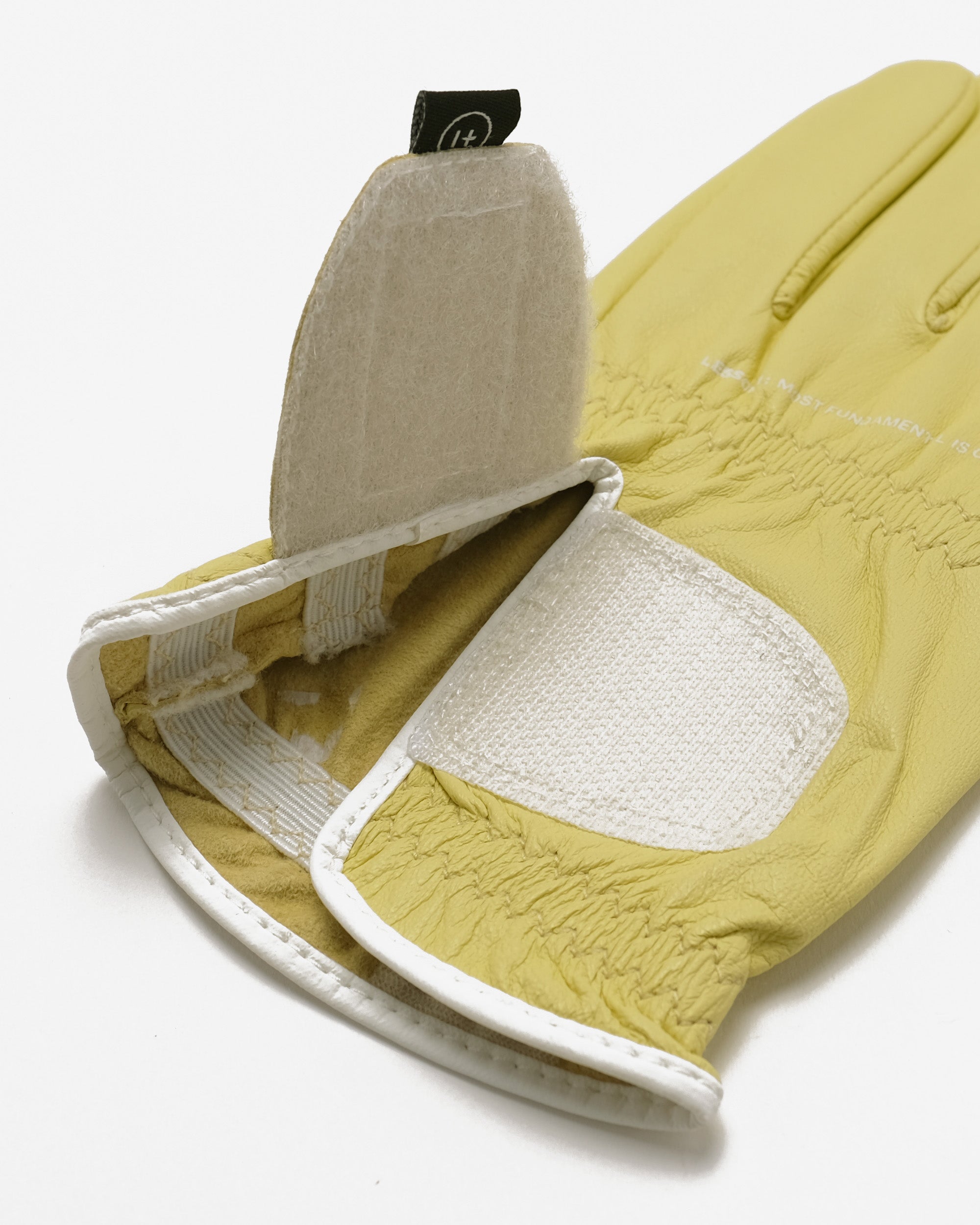 Yellow glove with white interior on a white background