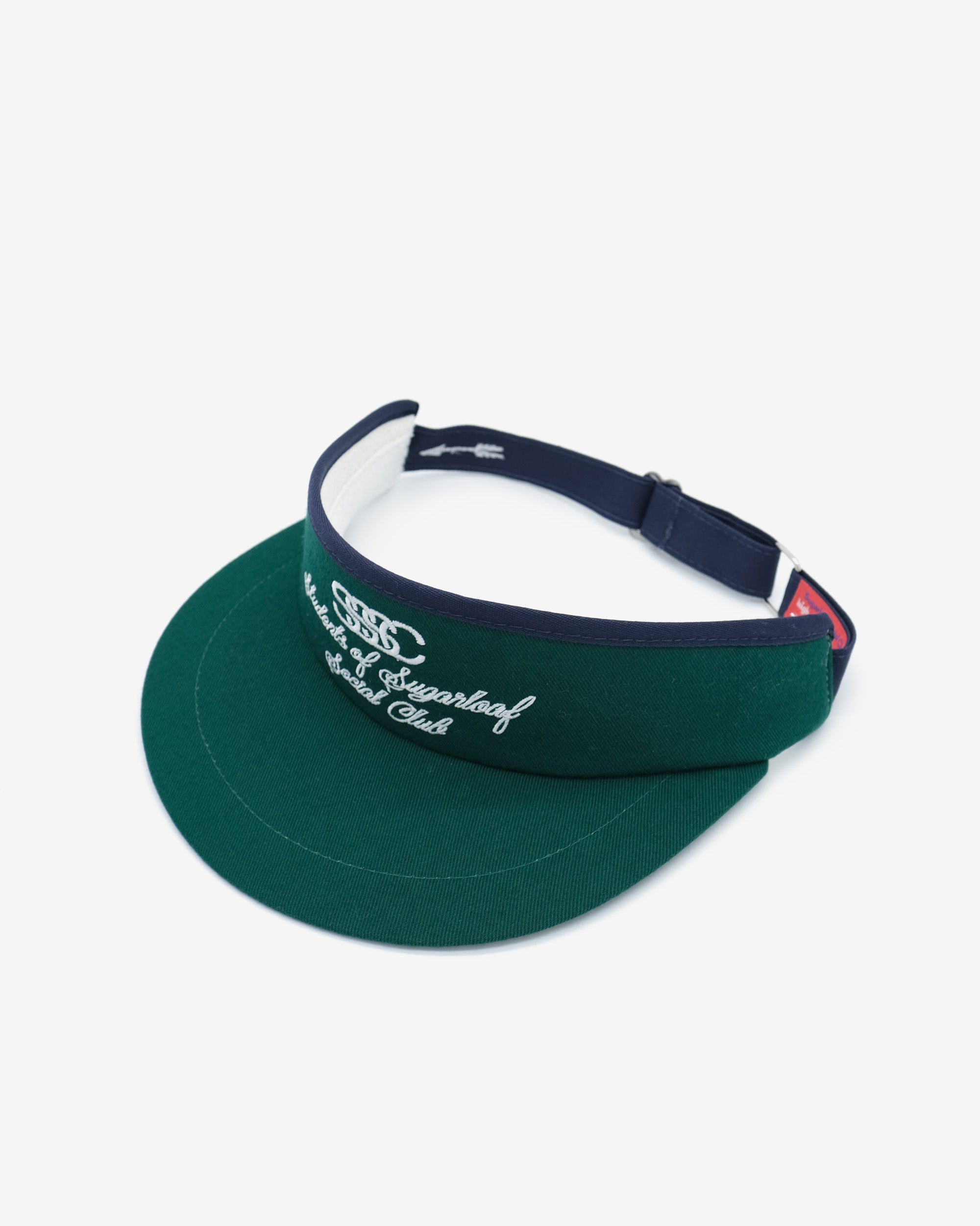 Green visor with navy strap on a white background