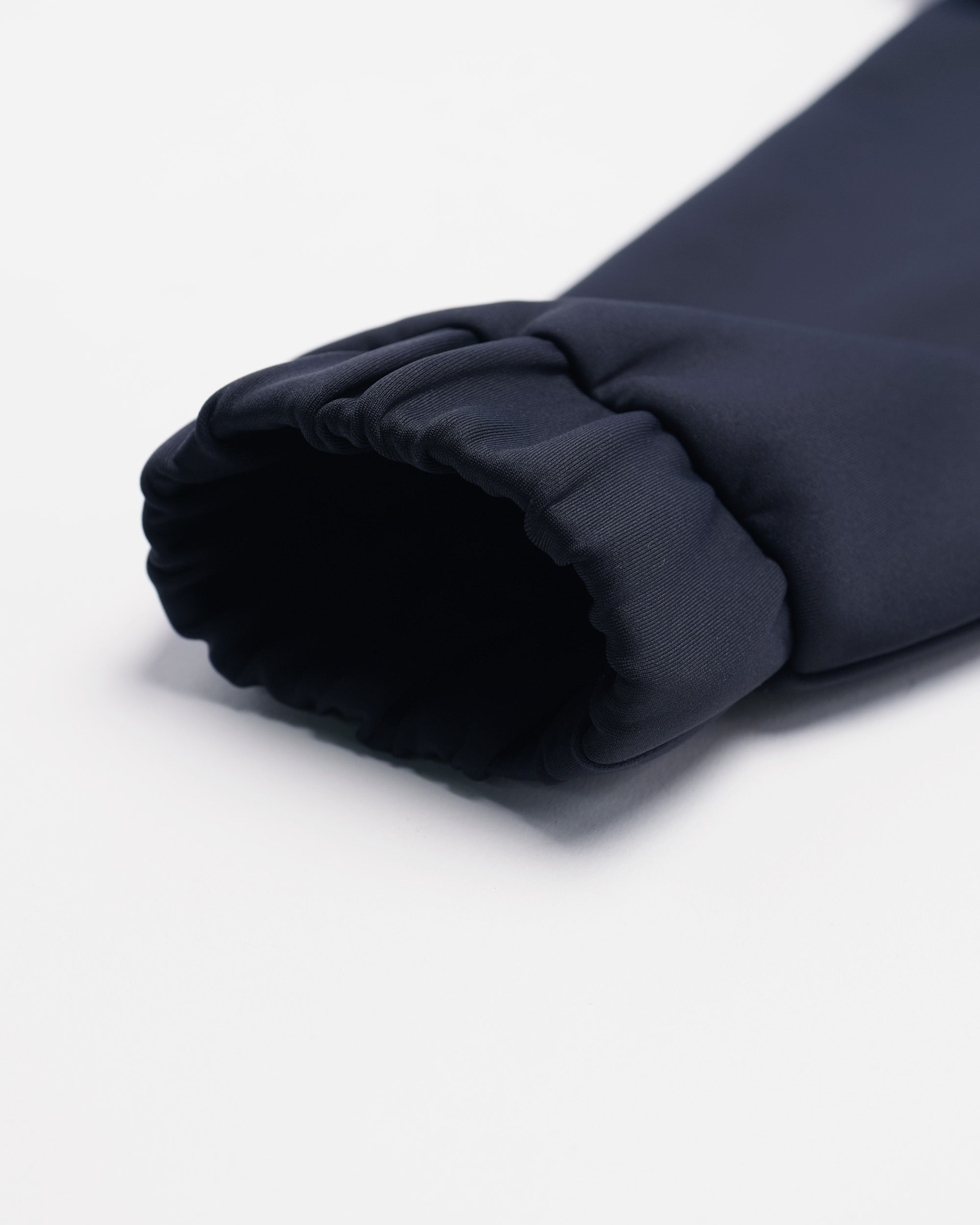 Dark blue fabric roll on a white background