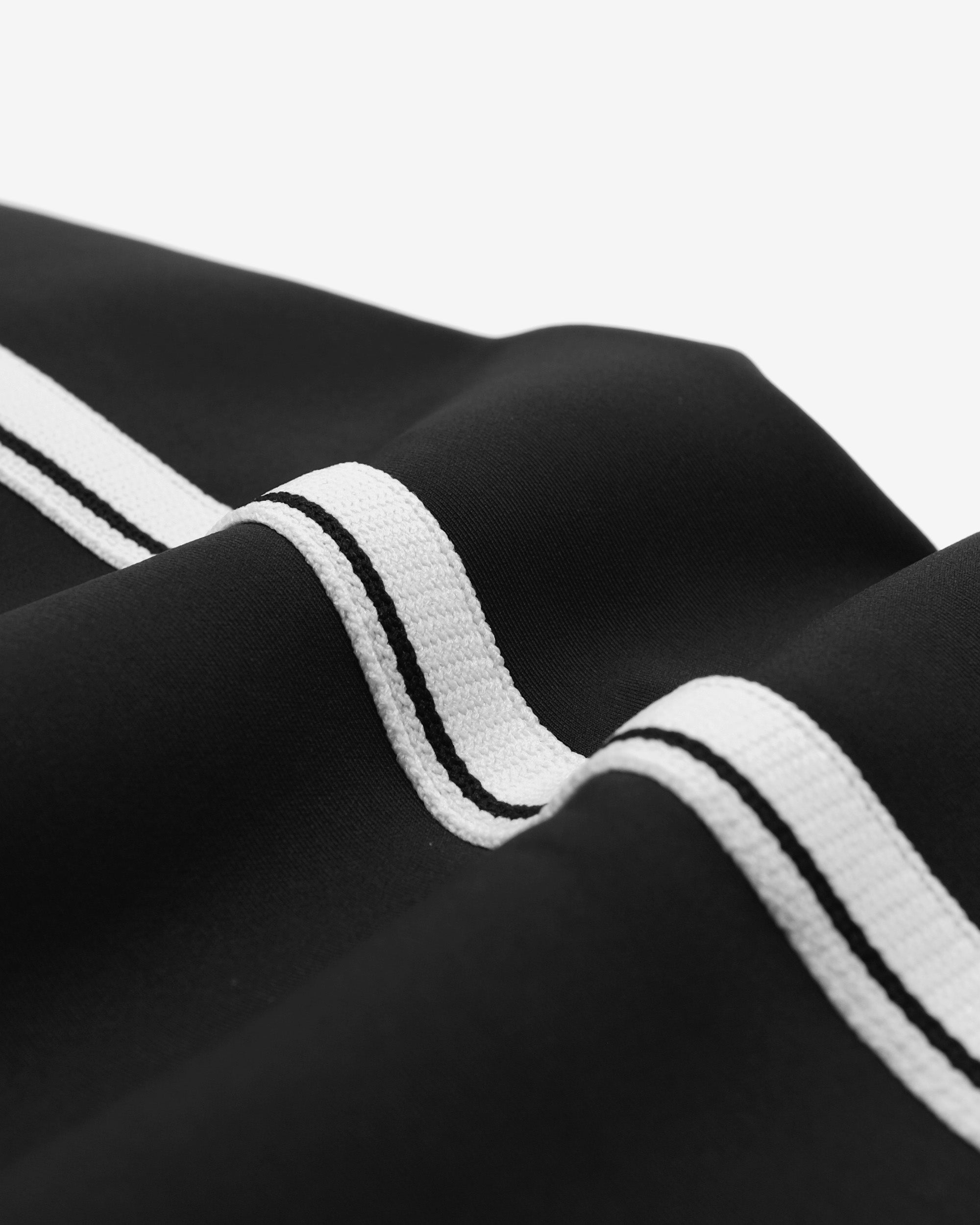 Close-up of black fabric with white stripes on a white background
