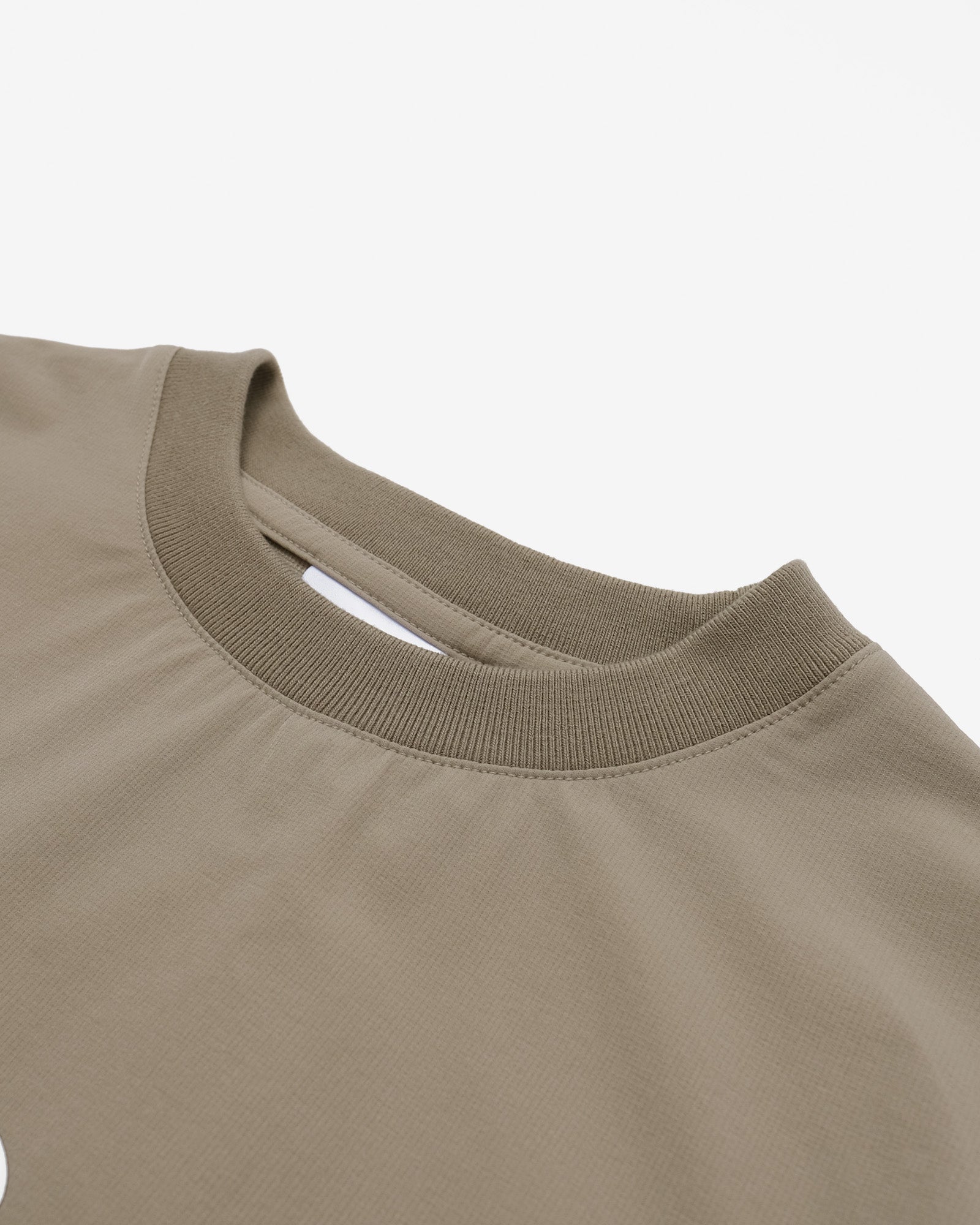 Close-up of a beige sweatshirt collar on a white background