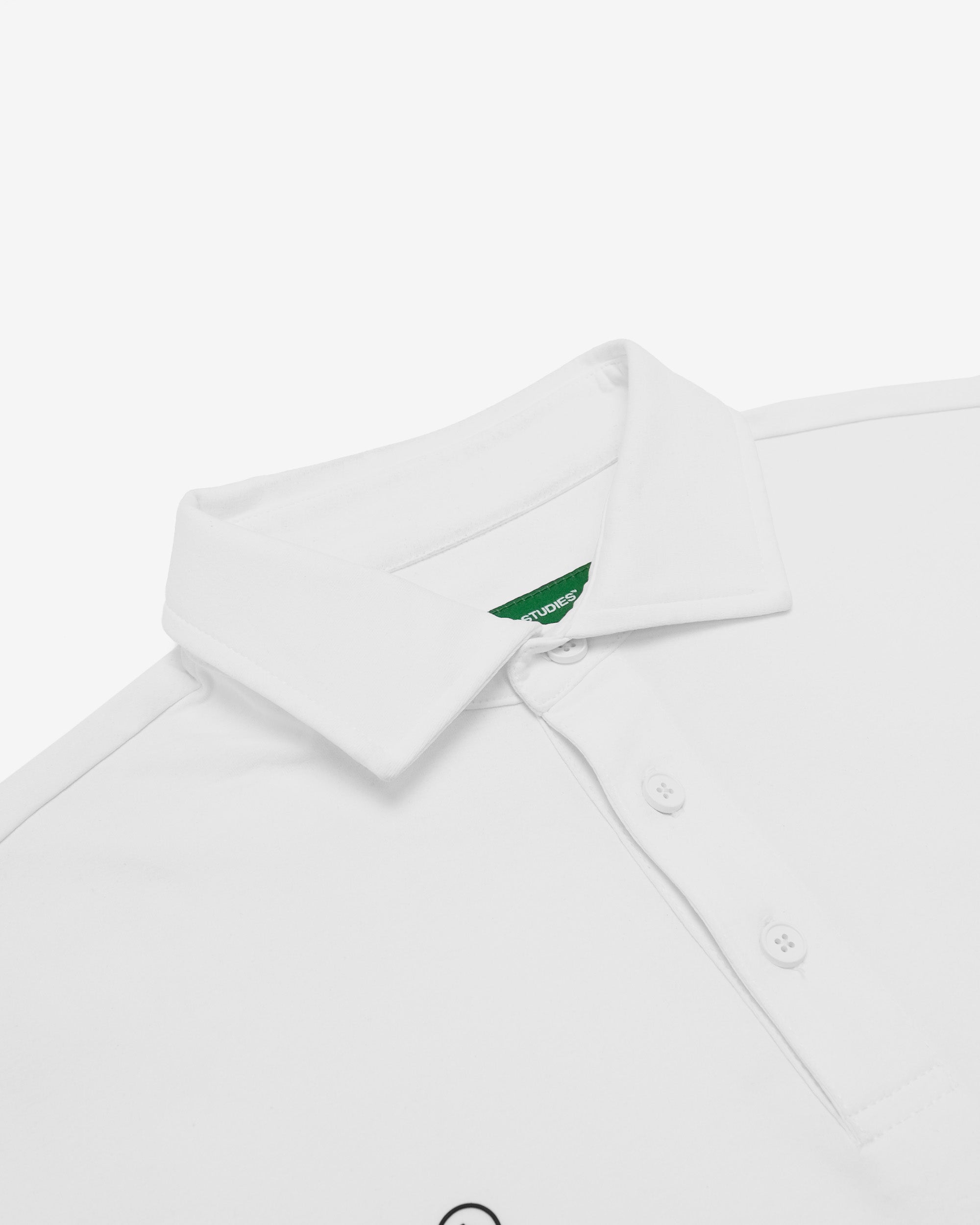 White polo shirt with a green logo on a white background