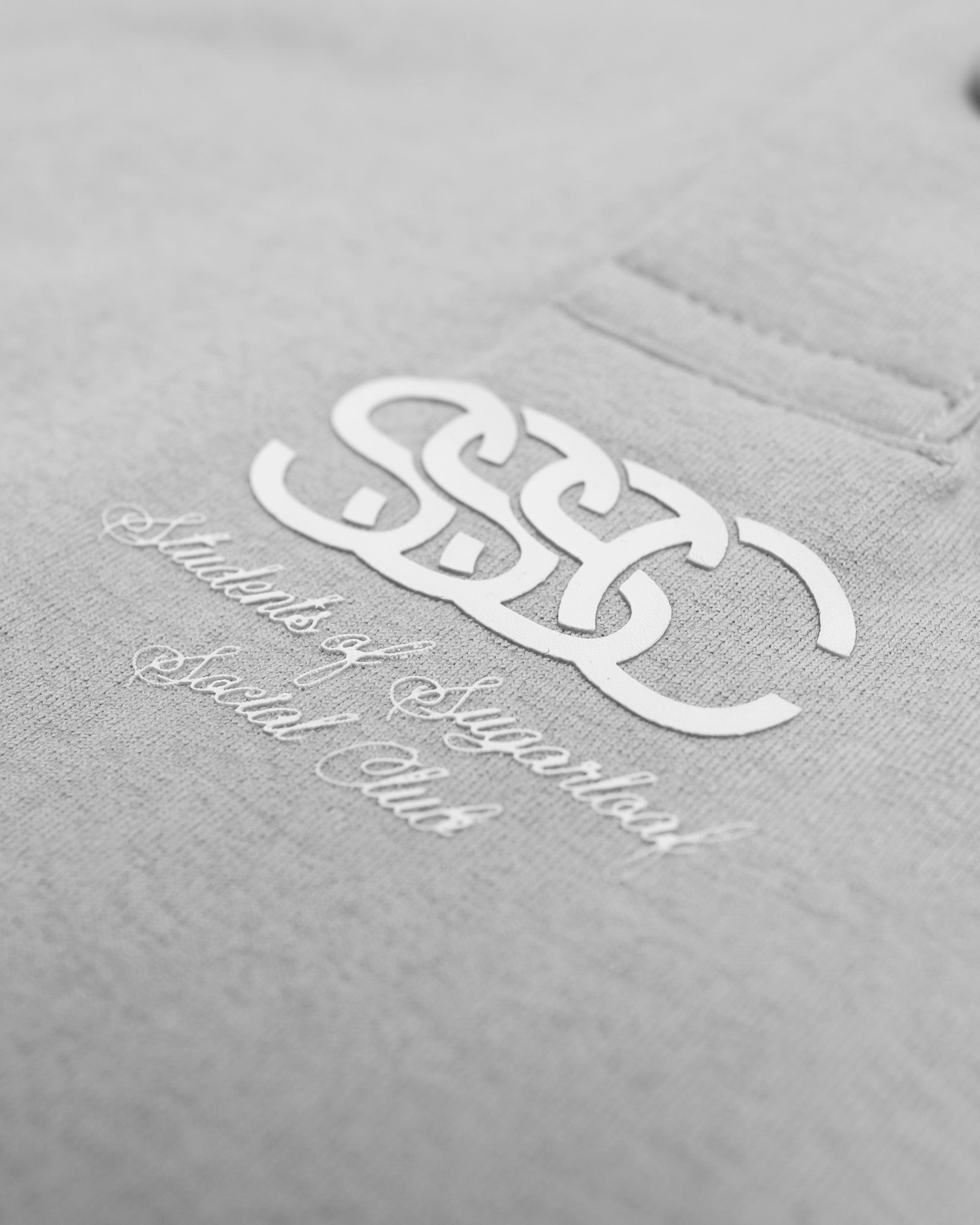 Gray sweatshirt with white logo and text on a gray background