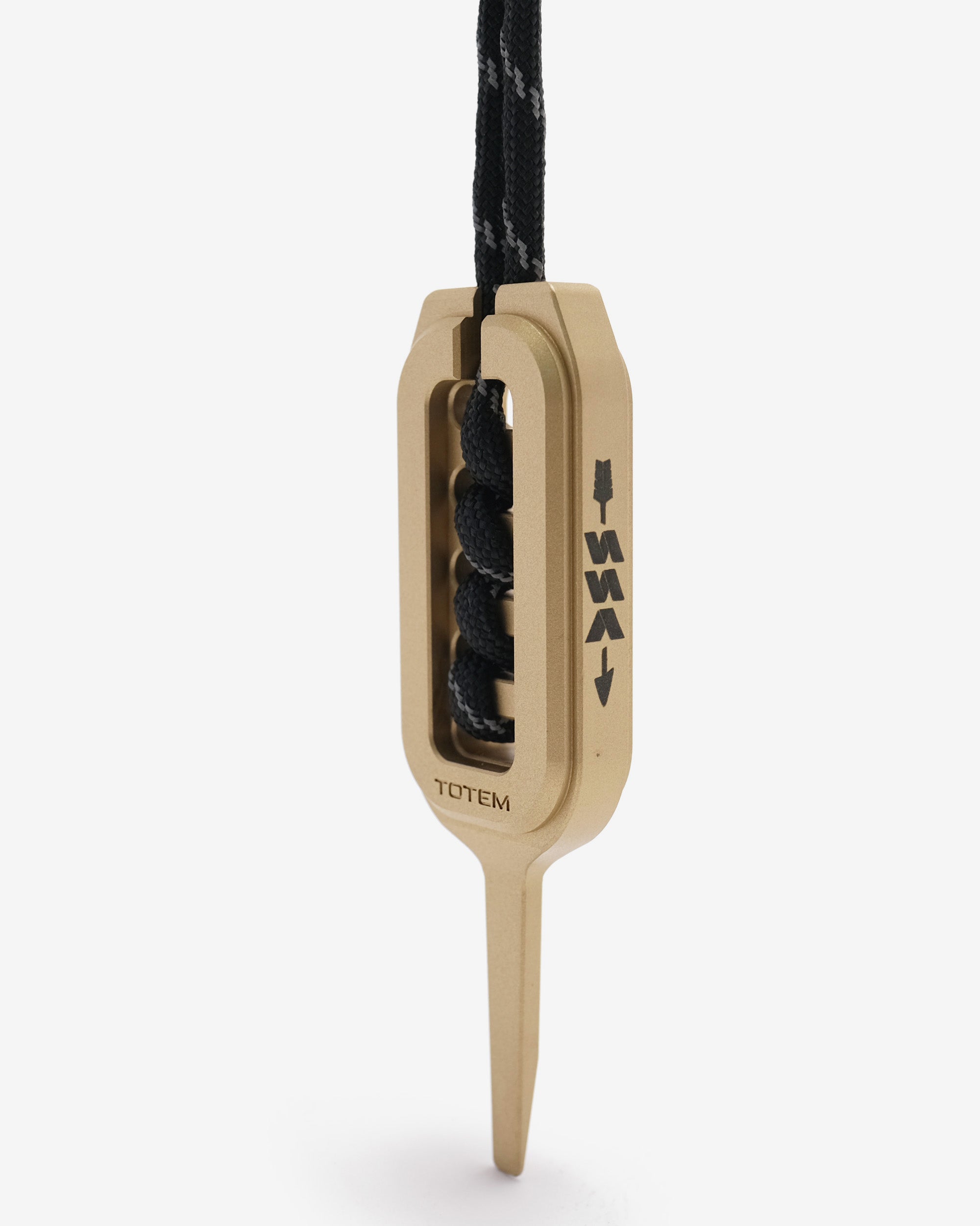 Beige pendant with black divot on a white background