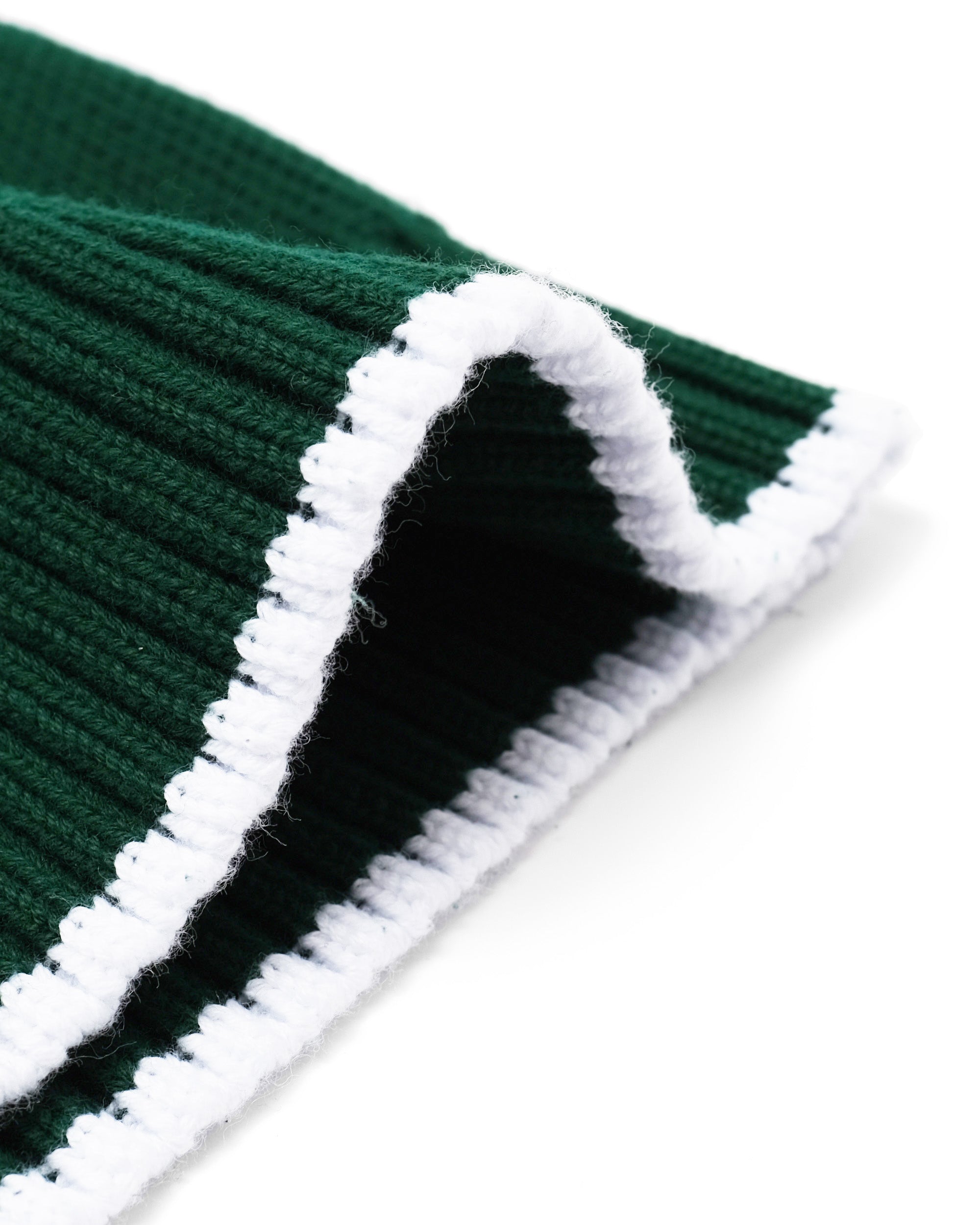 Close-up of green and white striped fabric with a textured pattern.