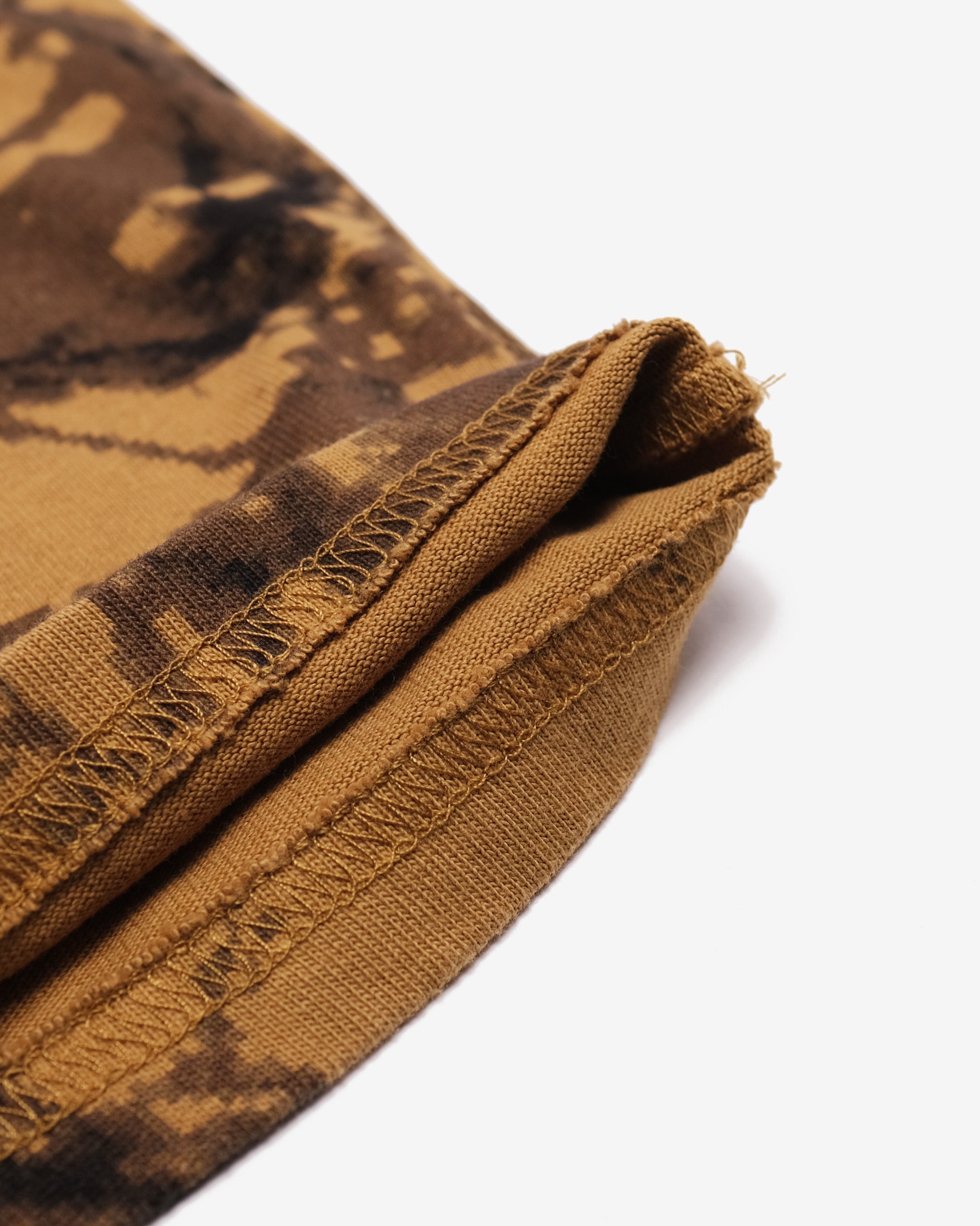 Close-up of brown camouflage fabric on a white background